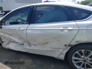 2020 Ford Fusion SE z VIN 3FA6P0LU5LR153942, wystawiony jako IAAI lot #42145638 z przebiegiem 99 961 mil mil oraz . Historia ofert i sprzedaży dostępna na DreamBid. Obrazek 14.