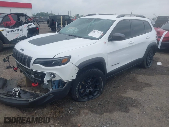 2021 Jeep Cherokee Trailhawk with VIN 1C4PJMBX4MD239112, listed as a IAAI auction lot 42271040 with 62,917 mi miles and . Bid and sale history available at DreamBid. Image 2.