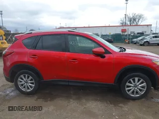 2014 Mazda CX-5 Touring z VIN JM3KE2CY3E0424892, wystawiony jako IAAI lot #42016801 z przebiegiem 173 350 mil mil oraz . Historia ofert i sprzedaży dostępna na DreamBid. Obrazek 13.