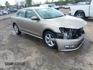 2015 Volkswagen Passat 1.8T Limited Edition with VIN 1VWAT7A32FC120769, listed as a IAAI auction lot 42013547 with 61,451 mi miles. Bid and sale history available at carsss.com. Image 1.