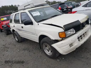 1998 Isuzu Rodeo S z VIN 4S2CM58W4W4303926, wystawiony jako IAAI lot #41908569 z przebiegiem 212 353 mil mil oraz . Historia ofert i sprzedaży dostępna na DreamBid. Obrazek 1.