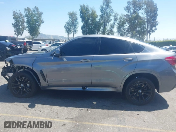 2018 BMW X6 xDrive35i z VIN 5UXKU2C51J0X50913, wystawiony jako IAAI lot #42078443 z przebiegiem Nie podano mil oraz . Historia ofert i sprzedaży dostępna na DreamBid. Obrazek 13.