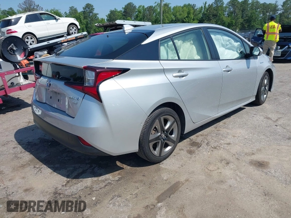 2021 Toyota Prius L Eco z VIN JTDKAMFU5M3137298, wystawiony jako IAAI lot #42270937 z przebiegiem 38 828 mil mil oraz . Historia ofert i sprzedaży dostępna na DreamBid. Obrazek 4.
