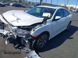2018 Honda Civic EX with VIN 2HGFC2F71JH502564, listed as a IAAI auction lot 41933157 with 56,696 mi miles and . Bid and sale history available at DreamBid. Image 2.
