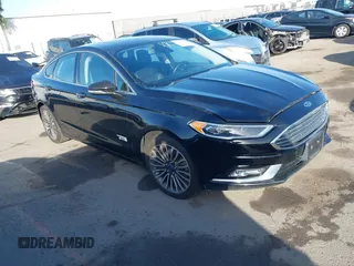 2017 Ford Fusion Energi SE with VIN 3FA6P0PU0HR129792, listed as a IAAI auction lot 41104376 with 86,659 mi miles. Bid and sale history available at carsss.com. Image 1.