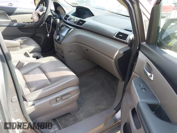 2014 Honda Odyssey Touring with VIN 5FNRL5H92EB073085, listed as a IAAI auction lot 42065913 with 120,834 mi miles and . Bid and sale history available at DreamBid. Image 5.