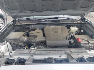 2021 Toyota Tacoma SR with VIN 5TFCZ5AN3MX258746, listed as a IAAI auction lot 42252967 with 62,095 mi miles and . Bid and sale history available at DreamBid. Image 10.