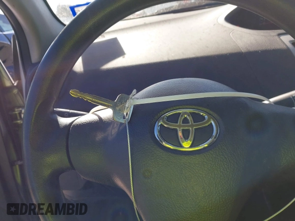 2012 Toyota Yaris z VIN JTDBT4K35CL038860, wystawiony jako IAAI lot #41254384 z przebiegiem 161 536 mil mil oraz . Historia ofert i sprzedaży dostępna na DreamBid. Obrazek 11.