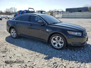 2014 Ford Taurus SEL with VIN 1FAHP2E85EG119210, listed as a Copart auction lot 51581795 with 165,128 mi miles and Salvage Title. Bid and sale history available at DreamBid. Image 4.