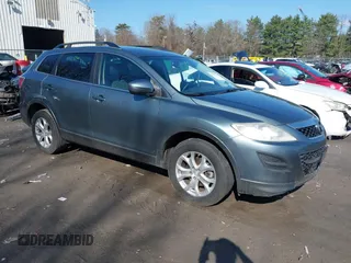 2012 Mazda CX-9 Sport with VIN JM3TB3BV6C0353419, listed as a IAAI auction lot 42031346 with 125,719 mi miles and . Bid and sale history available at DreamBid. Image 1.