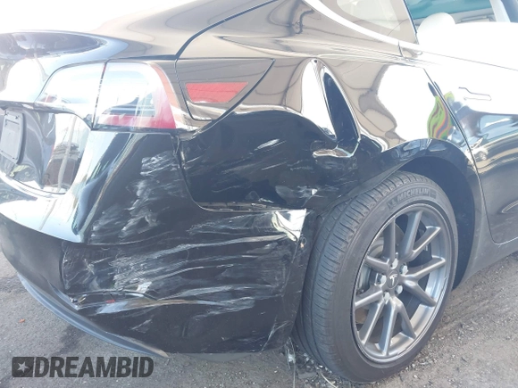 2020 Tesla Model 3 Standard Range Plus with VIN 5YJ3E1EA8LF661982, listed as a IAAI auction lot 41700109 with 30,271 mi miles and . Bid and sale history available at DreamBid. Image 6.