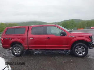 2018 Ford F-150 XL z VIN 1FTEW1EP4JFA70891, wystawiony jako IAAI lot #42219490 z przebiegiem 106 736 mil mil oraz . Historia ofert i sprzedaży dostępna na DreamBid. Obrazek 14.
