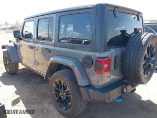 2023 Jeep Wrangler 4xe Sahara with VIN 1C4JJXP62PW696002, listed as a IAAI auction lot 41891127 with 44,567 mi miles. Bid and sale history available at carsss.com. Image 3.