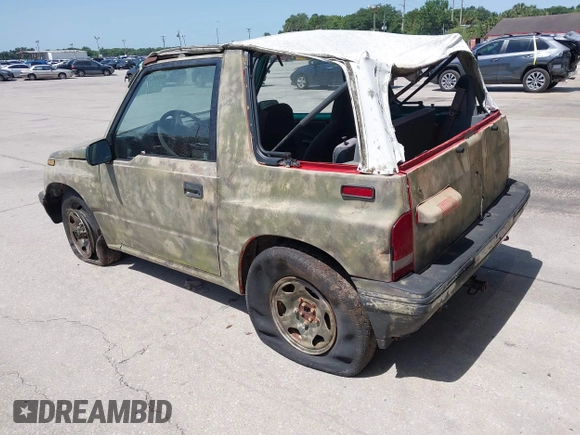 1995 Chevrolet Tracker z VIN 2CNBJ1869S6911342, wystawiony jako IAAI lot #42265392 z przebiegiem 121 944 mil mil oraz . Historia ofert i sprzedaży dostępna na DreamBid. Obrazek 3.