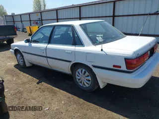 1990 Toyota Camry LE ECT z VIN JT2SV22E1L3427911, wystawiony jako IAAI lot #42040646 z przebiegiem 133 129 mil mil oraz . Historia ofert i sprzedaży dostępna na DreamBid. Obrazek 3.