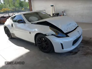 2014 Nissan 370Z Nismo z VIN JN1AZ4EH0EM633827, wystawiony jako IAAI lot #42235366 z przebiegiem 114 025 mil mil oraz . Historia ofert i sprzedaży dostępna na DreamBid. Obrazek 1.