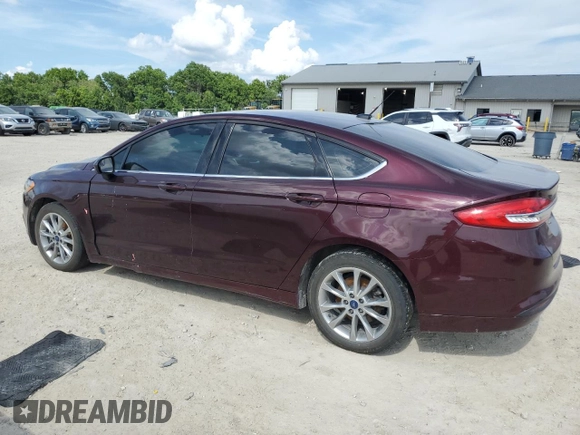 2017 Ford Fusion SE with VIN 3FA6P0H76HR415381, listed as a Copart auction lot 62000325 with 173,319 mi miles and Salvage title. Bid and sale history available at DreamBid. Image 2.