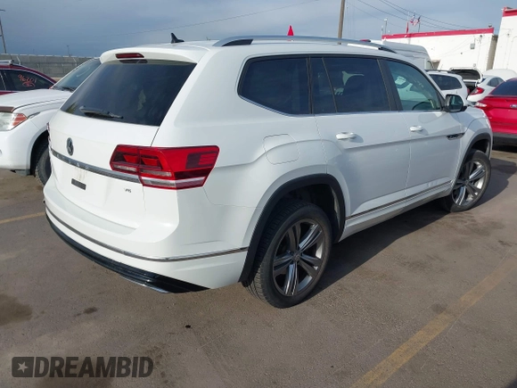 2018 Volkswagen Atlas SE z VIN 1V2FR2CA2JC540657, wystawiony jako IAAI lot #42115554 z przebiegiem 107 309 mil mil oraz . Historia ofert i sprzedaży dostępna na DreamBid. Obrazek 4.