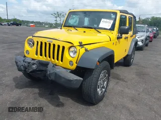2015 Jeep Wrangler Unlimited Willys Wheeler with VIN 1C4BJWDG2FL643375, listed as a IAAI auction lot 42109724 with 112,357 mi miles and . Bid and sale history available at DreamBid. Image 6.