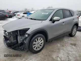 2015 Mazda CX-5 Sport with VIN JM3KE4BEXF0499688, listed as a Copart auction lot 88988095 with 258,460 mi miles and Salvage title. Bid and sale history available at DreamBid. Image 1.