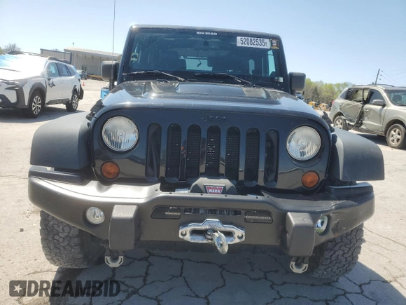 2013 Jeep Wrangler Sahara with VIN 1C4AJWBG8DL602065, listed as a Copart auction lot 52082535 with 110,727 mi miles and Salvage title. Bid and sale history available at DreamBid. Image 5.
