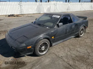 1986 Toyota MR2 z VIN JT2AW15C8G0053673, wystawiony jako Copart lot #88160225 z przebiegiem 165 867 mil mil oraz Szkody całkowita. Historia ofert i sprzedaży dostępna na DreamBid. Obrazek 1.