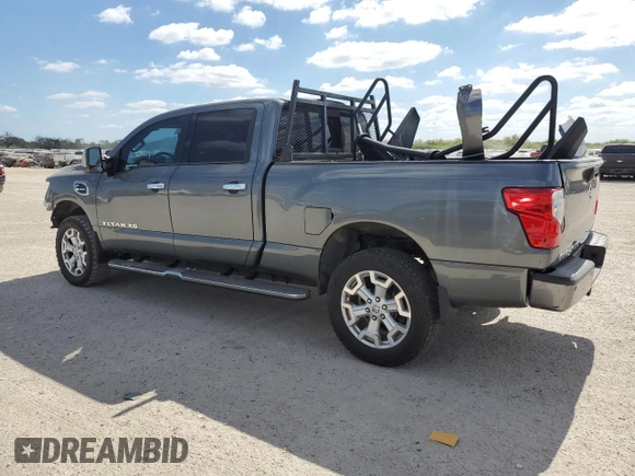 2016 Nissan Titan XD PRO-4X with VIN 1N6BA1F47GN512757, listed as a Copart auction lot 77429314 with 152,756 mi miles and Salvage Title. Bid and sale history available at carsss.com. Image 2.