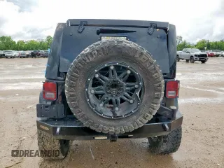 2015 Jeep Wrangler Unlimited Rubicon Hard Rock with VIN 1C4HJWFG1FL710264, listed as a Copart auction lot 54123285 with 96,737 mi miles and Salvage title. Bid and sale history available at DreamBid. Image 6.