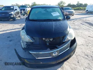 2009 Nissan Versa 1.8 SL with VIN 3N1BC13E79L476570, listed as a IAAI auction lot 41804750 with 160,449 mi miles. Bid and sale history available at carsss.com. Image 12.