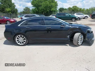 2016 Lincoln MKZ z VIN 3LN6L2J93GR632474, wystawiony jako IAAI lot #42607060 z przebiegiem 99 490 mil mil oraz . Historia ofert i sprzedaży dostępna na DreamBid. Obrazek 13.