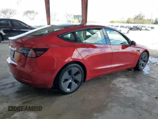 2022 Tesla Model 3 with VIN 5YJ3E1EA0NF329568, listed as a Copart auction lot 52594205 with 27,446 mi miles and Non Repairable. Bid and sale history available at carsss.com. Image 3.