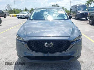 2024 Mazda CX-5 S Carbon Edition z VIN JM3KFBCLXR0521353, wystawiony jako IAAI lot #42351444 z przebiegiem 17 270 mil mil oraz . Historia ofert i sprzedaży dostępna na DreamBid. Obrazek 12.