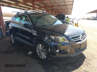 2011 Volkswagen Tiguan SEL w/Premium Navi z VIN WVGAV7AX3BW514348, wystawiony jako IAAI lot #42301169 z przebiegiem 86 611 mil mil oraz . Historia ofert i sprzedaży dostępna na DreamBid. Obrazek 1.