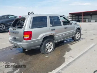 2000 Jeep Grand Cherokee Laredo with VIN 1J4GW48N5YC322707, listed as a IAAI auction lot 42080677 with Not provided miles and . Bid and sale history available at DreamBid. Image 4.