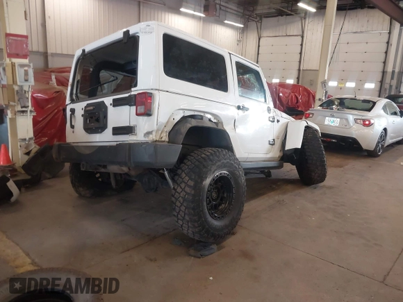 2012 Jeep Wrangler Arctic z VIN 1C4AJWBG9CL233232, wystawiony jako IAAI lot #42282805 z przebiegiem 109 927 mil mil oraz . Historia ofert i sprzedaży dostępna na DreamBid. Obrazek 4.