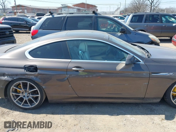 2012 BMW 6 Series 650i z VIN WBALX3C57CC528832, wystawiony jako IAAI lot #41779268 z przebiegiem 75 119 mil mil oraz . Historia ofert i sprzedaży dostępna na DreamBid. Obrazek 13.