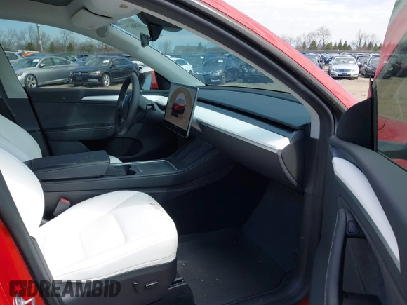 2023 Tesla Model Y Long Range with VIN 7SAYGDEE6PA157652, listed as a IAAI auction lot 41866777 with 22,584 mi miles. Bid and sale history available at carsss.com. Image 5.