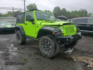 2012 Jeep Wrangler Sport with VIN 1C4AJWAG2CL233722, listed as a Copart auction lot 61125095 with 49,864 mi miles and Salvage title. Bid and sale history available at DreamBid. Image 13.