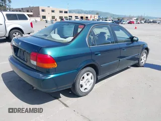 1998 Honda Civic EX with VIN JHMEJ8647WS001024, listed as a IAAI auction lot 41956420 with 198,954 mi miles. Bid and sale history available at carsss.com. Image 4.