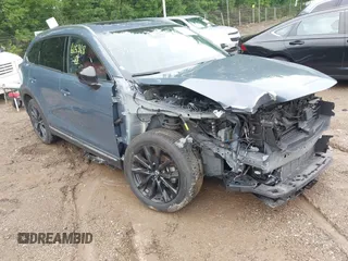 2022 Mazda CX-9 Grand Touring with VIN JM3TCBDY0N0615968, listed as a IAAI auction lot 42312159 with 22,912 mi miles and . Bid and sale history available at DreamBid. Image 1.