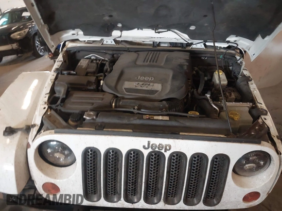2012 Jeep Wrangler Arctic z VIN 1C4AJWBG9CL233232, wystawiony jako IAAI lot #42282805 z przebiegiem 109 927 mil mil oraz . Historia ofert i sprzedaży dostępna na DreamBid. Obrazek 10.