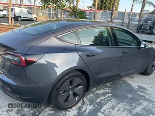 2023 Tesla Model 3 with VIN 5YJ3E1EA1PF607137, listed as a Copart auction lot 62613375 with 27,271 mi miles and Clean title. Bid and sale history available at DreamBid. Image 4.