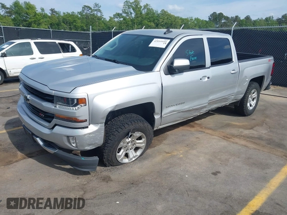2017 Chevrolet Silverado 1500 LT with VIN 3GCUKREC5HG285689, listed as a IAAI auction lot 42055959 with 128,237 mi miles and . Bid and sale history available at DreamBid. Image 2.