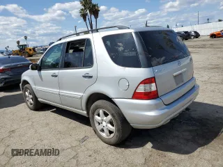 2004 Mercedes-Benz M-Class with VIN 4JGAB75EX4A470494, listed as a Copart auction lot 52024515 with 185,639 mi miles and Salvage Title. Bid and sale history available at carsss.com. Image 2.