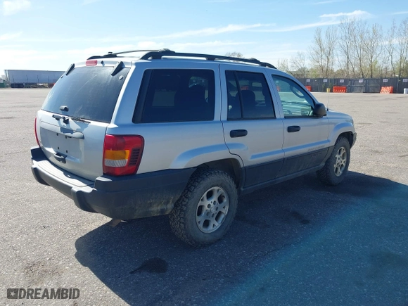 2003 Jeep Grand Cherokee Laredo with VIN 1J4GW48S03C567770, listed as a IAAI auction lot 42028727 with 245,728 mi miles. Bid and sale history available at carsss.com. Image 4.