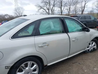 2008 Mercury Sable Premier z VIN 1MEHM43W58G601548, wystawiony jako IAAI lot #41843679 z przebiegiem 62 196 mil mil oraz . Historia ofert i sprzedaży dostępna na DreamBid. Obrazek 13.