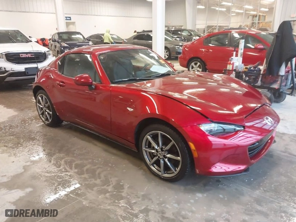 2023 Mazda MX-5 Miata RF Grand Touring with VIN JM1NDAM75P0558590, listed as a IAAI auction lot 41479610 with 4,446 mi miles. Bid and sale history available at carsss.com. Image 1.
