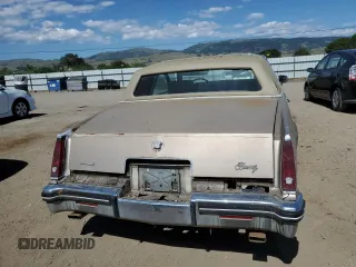 1985 Cadillac Eldorado z VIN 1G6EL578XFE661216, wystawiony jako Copart lot #54606984 z przebiegiem 12 462 mil mil oraz Szkody całkowita. Historia ofert i sprzedaży dostępna na DreamBid. Obrazek 6.
