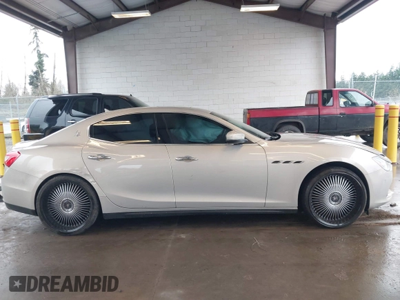 2017 Maserati Ghibli with VIN ZAM57XSLXH1238134, listed as a IAAI auction lot 41871754 with 34,776 mi miles. Bid and sale history available at carsss.com. Image 12.