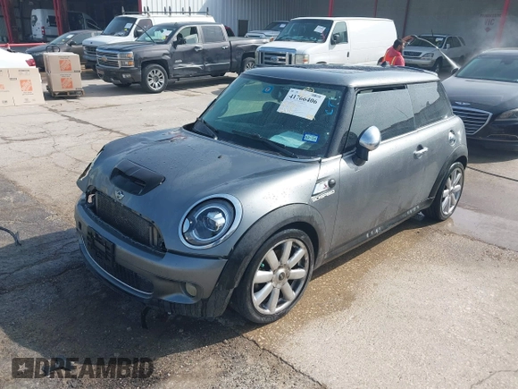 2009 MINI Hardtop S with VIN WMWMF73509TW86792, listed as a IAAI auction lot 41766406 with 174,724 mi miles and . Bid and sale history available at DreamBid. Image 2.